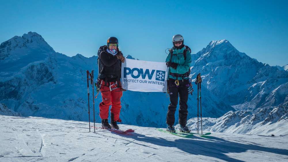 Two POW members ski touring with Aoraki Mt Cool in the background